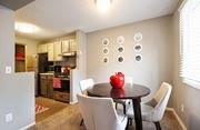 Eden Prairie apartment for rent - a dining room with a table and chairs and a kitchen