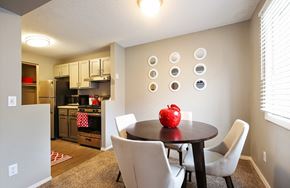Eden Prairie apartment for rent - a dining room with a table and chairs and a kitchen