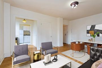 Seattle apartment for rent - A living room with a white table and chairs.