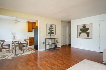 Portland apartment for rent - A living room with a dining table and chairs.