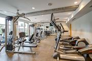 Minneapolis apartment for rent - Gym with treadmills, weights, and exercise equipment at Track 29 Apartments, Minneapolis, MN, 55408