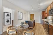 Minneapolis apartment for rent - A modern kitchen with a glass table and chairs.