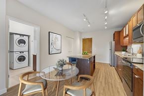 Minneapolis apartment for rent - A modern kitchen with a glass table and chairs.