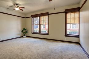 Portland apartment for rent - an empty living room with two windows and a ceiling fan at Whitney Gray, Oregon, 97205?
