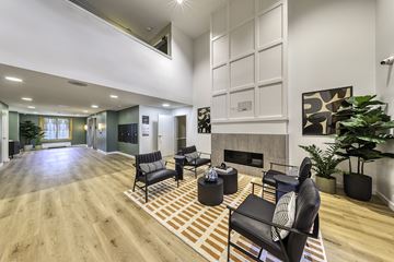 Oak Park apartment for rent - A living room with a fireplace and a large painting on the wall.