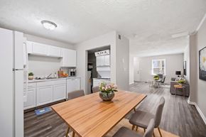 Winchester apartment for rent - A modern kitchen with a wooden table and chairs.