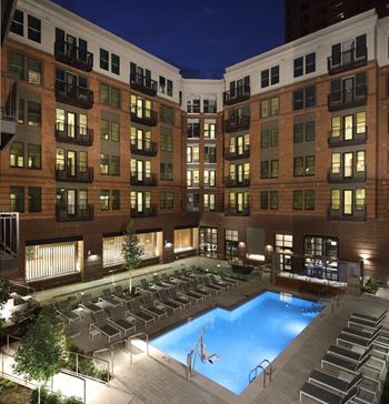 Resort-style pool with outdoor grills