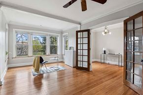 Oak Park apartment for rent - the living room has a hardwood floor and a large window at The Bryant at Oak Park I & II, Oak Park, 60302