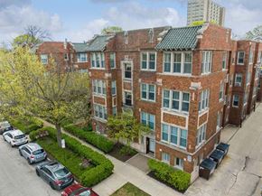 Oak Park apartment for rent - an aerial view of a brick apartment building with a parking lot at The Bryant at Oak Park I & II, Illinois, 60302