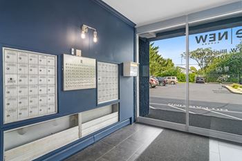 The entrance to a wii game room with a glass door