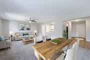 Eden Prairie apartment for rent - A dining room with a wooden table and chairs.