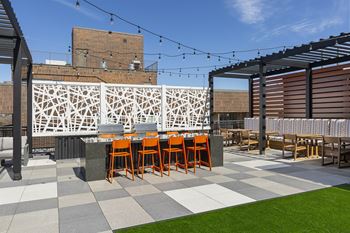 Spacious outdoor patio with orange chairs