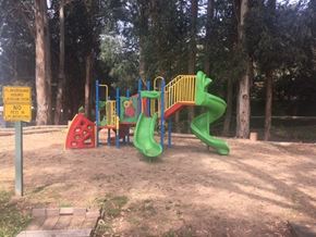 Salinas apartment for rent - A playground with a green slide and a red and yellow structure at Salinas Sunset Apartments, Salinas, 93907