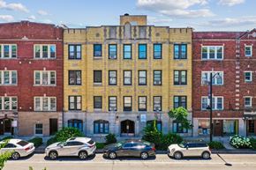 Oak Park apartment for rent - A row of buildings with cars parked in front.