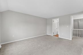Ellington apartment for rent - A spacious room with a carpeted floor and white walls.