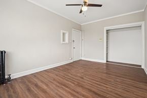 Oak Park apartment for rent - A room with a ceiling fan and a sliding door.