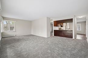 Clarendon Hills apartment for rent - A spacious room with a grey carpet and white walls.