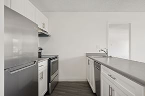 North Vancouver apartment for rent - A kitchen with white cabinets and stainless steel appliances.