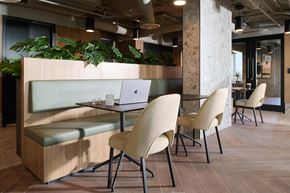 Vancouver apartment for rent - A modern office space with a wooden table and chairs.