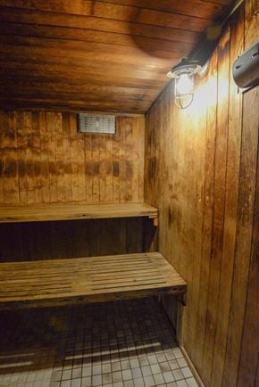 Vancouver apartment for rent - A wooden bench sits in a room with wooden walls.