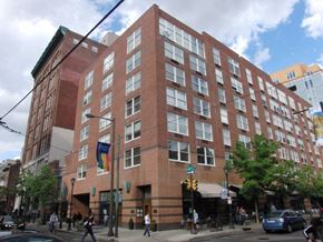 Philadelphia apartment for rent - a large brick building on the corner of a city street