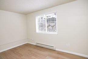 Puyallup apartment for rent - A room with a window and a radiator on the floor.