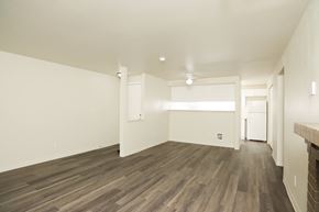 Federal Way apartment for rent - A room with wooden floors and white walls.