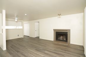 Federal Way apartment for rent - A living room with a fireplace and wood flooring.