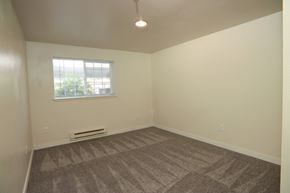 Puyallup apartment for rent - A room with a carpeted floor and a window.