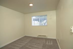 Puyallup apartment for rent - A room with a window and a carpet on the floor.