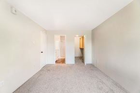Kent apartment for rent - A spacious room with carpeted floor and white walls.