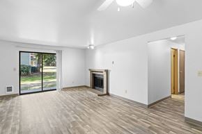 Federal Way apartment for rent - A room with a fireplace and sliding glass doors.