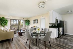 Escondido apartment for rent - A well-lit, modern kitchen and dining area with a wooden floor and furniture.