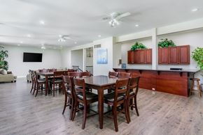 Escondido apartment for rent - A dining room with a long table and chairs.