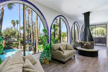 Escondido apartment for rent - A living room with a large couch and a fireplace.