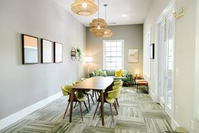 Greenville apartment for rent - A dining room with a round table and chairs.