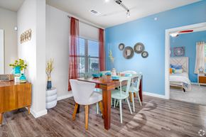 San Antonio apartment for rent - A dining room with a wooden table and chairs.