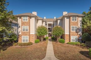 Charlotte apartment for rent - A residential building with a pathway leading to the entrance.