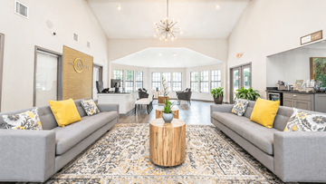 Duluth apartment for rent - A living room with grey couches and a wooden coffee table.