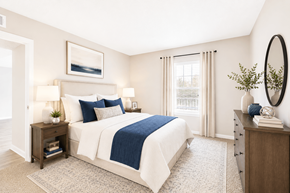 Sandy Springs apartment for rent - A bedroom with a bed, nightstands, and a window.