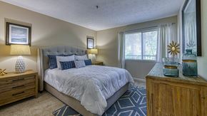 Atlanta apartment for rent - One Bedroom Apartments in Vinings, GA - Wynnwood Vinings - Furnished Bedroom with Plush Carpet Flooring and a Window