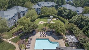Raleigh apartment for rent - an aerial view of an apartment complex with a pool