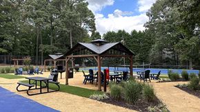 Raleigh apartment for rent - a picnic area with a pavilion next to a swimming pool