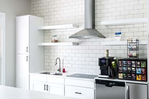 Charlotte apartment for rent - Leasing Center clubhouse modern kitchen at Whitehall Estate apartments in Charlotte NC