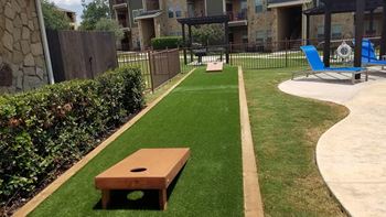 Outdoor gaming area with cornhole