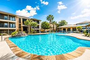 San Antonio apartment for rent - A large swimming pool in front of a resort building.