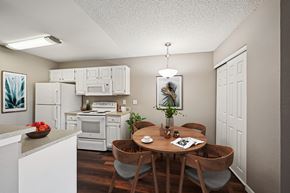 Castle Rock apartment for rent - A kitchen with a table and chairs in the middle of it.