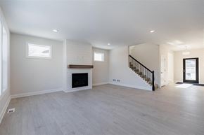 Blaine house for rent - A spacious living room with a fireplace and a staircase.