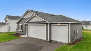 New Richmond house for rent - A two-car garage is attached to a house.