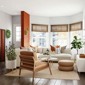 Raleigh apartment for rent - A living room with a white couch, a brown chair, and a white coffee table.